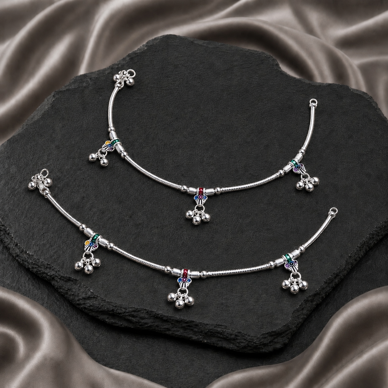 Pair of silver payals with colourful enamel details and bell charms
