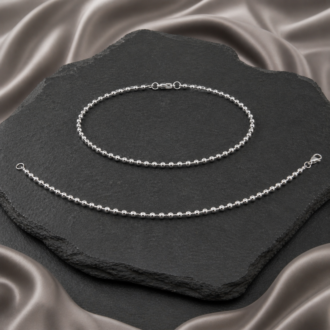Pair of round dana silver Payals, with one closed and one open to show its full length